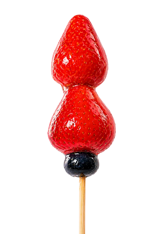 Two red strawberries Tanghulu on a skewer with a white background