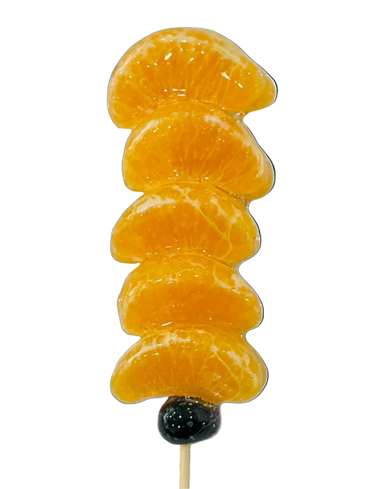 Sugar glazed Stack of orange slices on a stick 