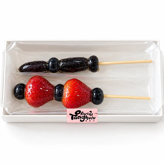 After Dark Duo by Olivia's Tanghulu: one Witch's Finger grape skewer and one Vampire's Heart strawberry skewer in a clear gift box
