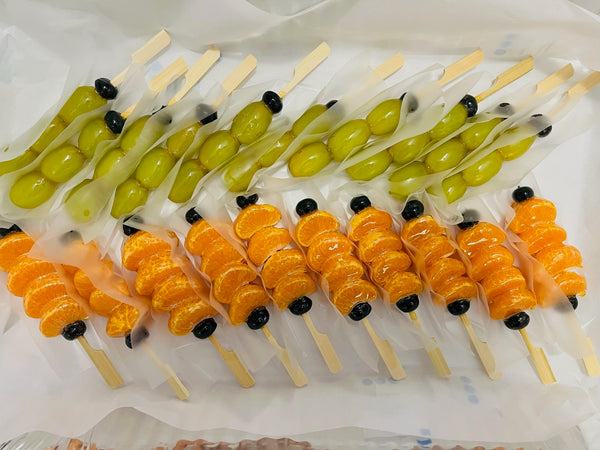 Tanghulu party pack arrangement — fresh candied fruit skewers for event catering